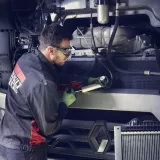 Man repairing trucks